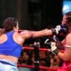 woman in blue sports bra and white shorts