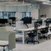 an office with a lot of desks and chairs