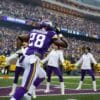 purple and white Peterson 28 running on stadium