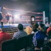 a group of people in a wrestling ring
