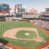 people watching baseball game during daytime