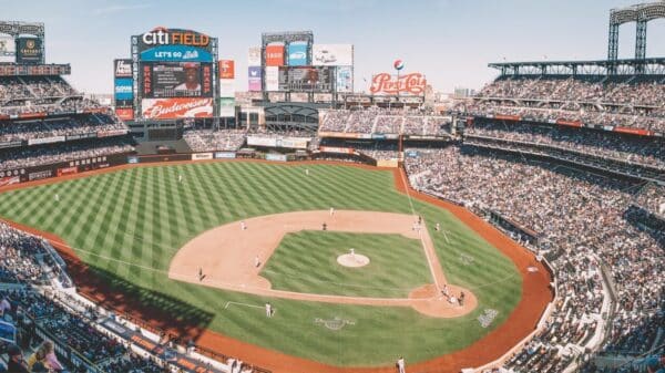 people watching baseball game during daytime