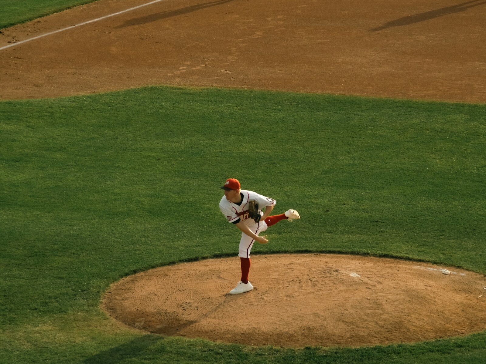 a baseball player throwing a ball